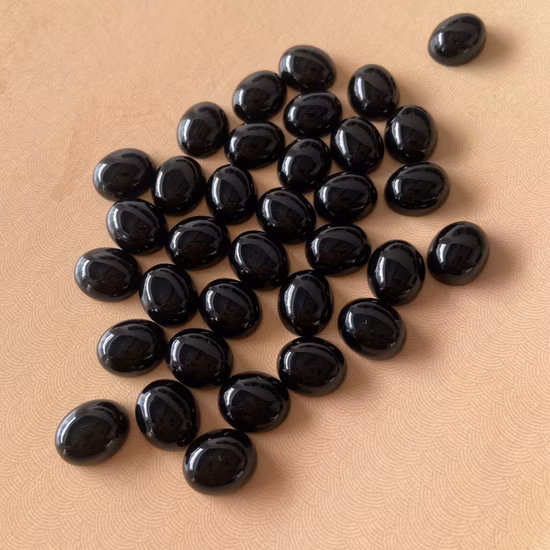 Cabochon ovale 5 x 7 mm saphir étoilé synthétique six rayons pierre précieuse pour la fabrication de bagues